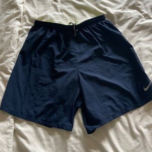 Navy Nike dri fit running shorts with lime green lining